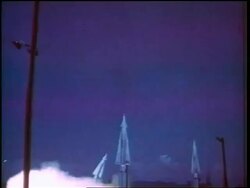1960s wide shot missile blasting off into sky (night?) / Cold War / documentary Stock Footage