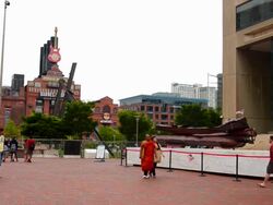WS Shot of Memorial Baltimore Maryland Inner harbor for 9/11 deaths of Baltimore people steel girders from World trade center in New York City with people walking area / Baltimore, Maryland, United States Stock Footage