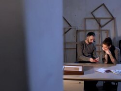 Art forger and artist looking at forged documents, dolly Stock Footage
