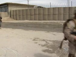 WS ZI Police officer and soldiers walking on dirt road / Mausa Qala, Helmand Province, Afghanistan.  Stock Footage