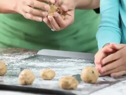 CU TD Mother and Daughter Baking Chocolate Chip Cookies in Kitchen / Richmond, Virginia, USA Stock Footage