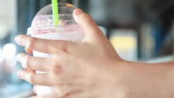 HD: hand put and hold ice tea on table. Stock Footage