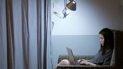 Woman working with laptop on sofa at home , lifestyle concept , 4k(UHD) Stock Footage