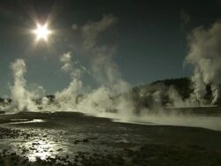 Extreme Long Shot static - Plumes of steam rise from hot springs in Yellowstone National Park. / Yellowstone National Park, Wyoming, USA Stock Footage