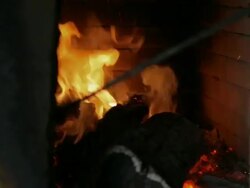 burning wood in a tandoor Stock Footage