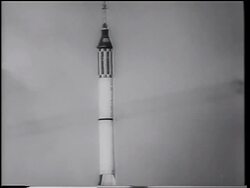 B/W 1961 tilt up Mercury 3 rocket rising in sky after blast off / Alan Shepard - first American in space Stock Footage