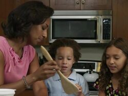 Slow motion of mother adding butter into bowl. Stock Footage