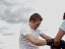 Two male boxing in park Stock Footage