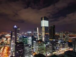WS T/L View of IFC tower in yeouido business district at night / Seoul, South Korea Stock Footage
