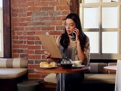 MS PAN Female cafe owner talking on phone / Santa Fe, New Mexico, United States Stock Footage