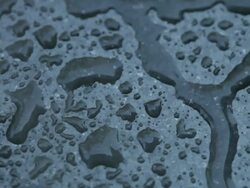 Rain Drops and Fog on Black Granite Stock Footage