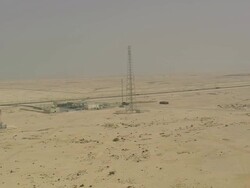 WS AERIAL View of big tower near cars moving on highway / Qatar Stock Footage