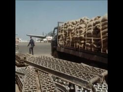SYND 11/02/71 THE CIA'S PRIVATE AIRLINE, "AIR AMERICA", DROPPING RELIEF SUPPLIES OF RICE TO LAOTIAN TRIBESMEN News Clip