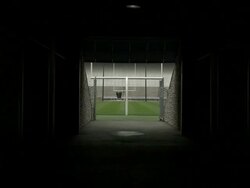 Shot from inside the tunnel at Beaver Stadium at Pennsylvania State University. Shot zooms in down the tunnel to the field Stock Footage