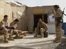 WS Soldiers having discussion / Musa Qala, Helmand Province, Afghanistan. Stock Footage