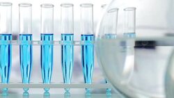 Beakers and test tubes on table Stock Footage
