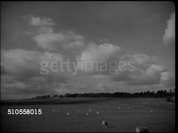 1944: IRELAND: FARMING: WS Countryside, WS Farm field, WS Thomond Bridge over River Shannon w/ King JohnÃ½s Castle on southern bank in Limerick, Hilltop XWS Killarney Lake district w/ mountains BG, sheep walking FG.  Agriculture, livestock. Instructional Video