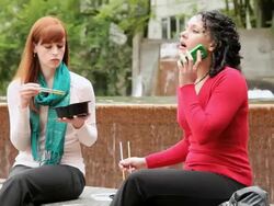 MS Two women at lunch break while interrupted by urgent phone calls / Portland, Oregon, USA Stock Footage