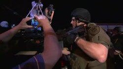 Scuffles, more arrests but a quieter night in town at centre of protests over police shooting Instructional Video