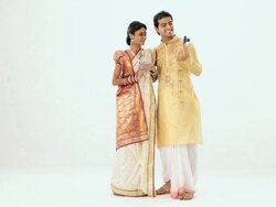 Bengali couple taking picture of themselves with a digital camera Stock Footage