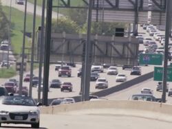 Long lens, huge traffic congestion on interstate highway. Stock Footage