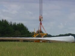 WS PAN ZO View of Blade gets lifted by crane / Macarthur, Victoria, Australia Stock Footage