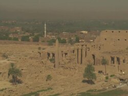 High Angle, aerial - Sandstone historical ruins with large pillars stand out in the Egyptian Nile Delta Stock Footage