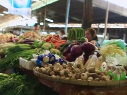 MS POV SLO MO Food stalls laden with vegetables eggs and packaged goods / Vientiane, Laos Stock Footage