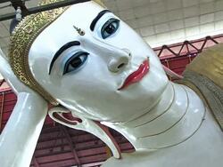 CU Shot of Face of Buddha statue inside temple / Yangon, Yangon Division, Myanmar  Stock Footage