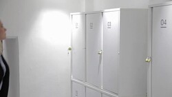 Woman leaving her bag in locker Stock Footage