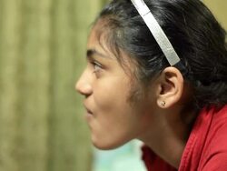 Casual Indian teenager girl blowing a bubble gum Stock Footage