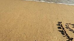 I love You note in sand Stock Footage