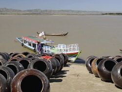 WS View of Boats and large clay pots stored on banks of Ayeyarwadi river for loading / Bagan, Mandalay Division, Myanmar Stock Footage