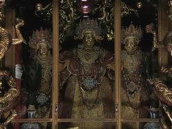 MS ZI Shot of shrine with three Buddha idols inside / Lhasa, Tibet, China Stock Footage