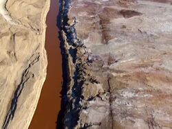 AERIAL TS WS  View of dead sea salt formations and canal  / Sourn Judea Desert, Israel  Stock Footage