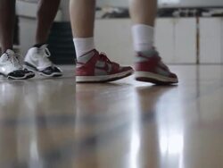 MS Two different pairs of mens feet playing basketball in  gymnasium / Minneapolis, Minnesota, United States  Stock Footage