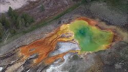 A Prismatic Pool In Norris Geyser Basin  - Aerial View - Wyoming,  Park County,  helicopter filming,  aerial video,  cineflex,  establishing shot,  United States Stock Footage