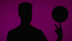 young soccer freestyler spins a ball on his fingers Stock Footage