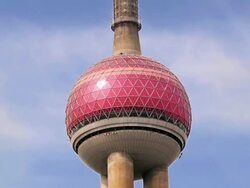 Medium shot low angle zoom out wide shot Oriental Pearl TV Tower / electronic billboard on building / time lapse clouds / Shanghai Stock Footage