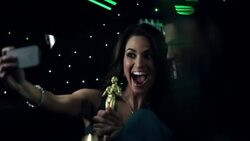 Hollywood couple in limousine snap silly photos with awards trophy at awards show Stock Footage