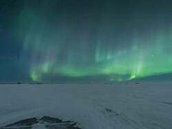 T/L of aurora with rocks in forground during early summer with slow dolly movement Stock Footage