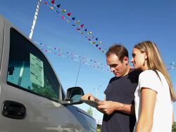 Couple shop for a vehicle Stock Footage