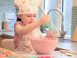 Little Girl cooking in kitchen Stock Footage