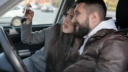 young adult couple taking selfie and kiss on the smartphone Stock Footage