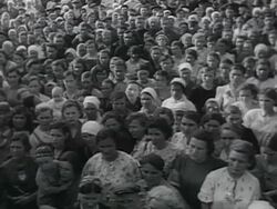 MS PAN Large crowds of civilians listening to Stalin's public address through loudspeakers announcing Russia at war AUDIO / Russia Stock Footage