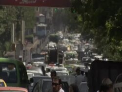 Heat haze enveloping bustling street filled with cars and pedestrians, Tehran, Iran (sound available) Stock Footage