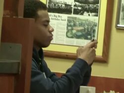 Tristan Wilds on phone at Bob's Big Boy in Burbank Stock Footage