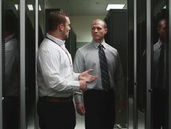 two people in a server room Stock Footage