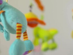 HD: Cute Twirling Crib Toy Stock Footage