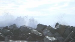 Medium Shot,Short,Slow Motion/ Wave breaking at a cluster of rocks, Ocean/ USA Stock Footage